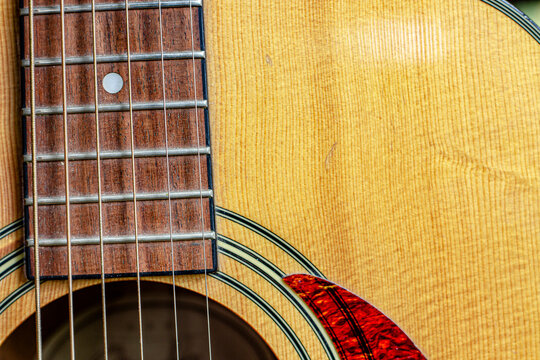 Nashville Acoustic Guitar Sound Hole, slanted with strings and detail of wood grain and design  Royalty free stock photo