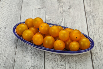 Fresh yellow cherry tomato heap