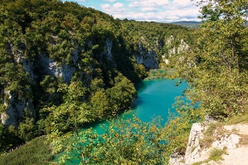 Fototapeta na wymiar Landscape of waterfall and turquoise lake in the forest. Plitvice Lakes National Park. Nacionalni park Plitvicka Jezera, one of the oldest and largest national parks in Croatia. UNESCO World Heritage.