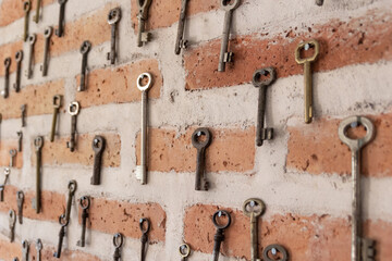 key collection on a old brick wall