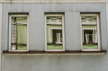 Three windows with reflection