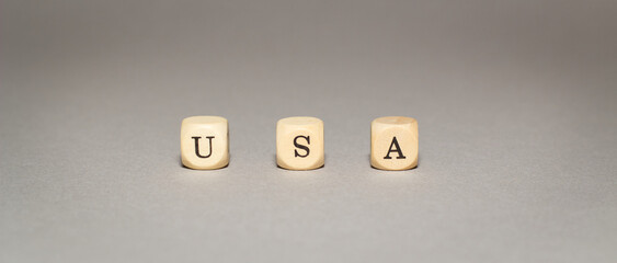 USA written with letter cubes, Illustration, isolated on grey background, United Stated of America