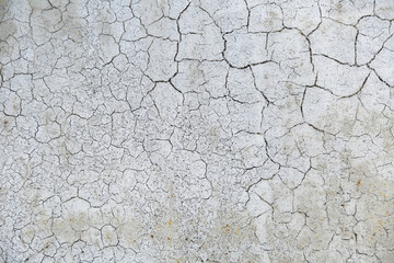 cracks on old paint on rusty metal. beautiful background with cracks on the silver painted wall