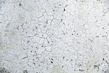 cracks on old paint on rusty metal. beautiful background with cracks on the silver painted wall