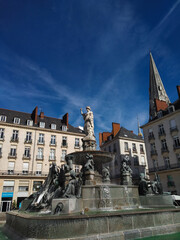 Green carpeted grass and a brown leaf frozen with frost on a cold winter morning