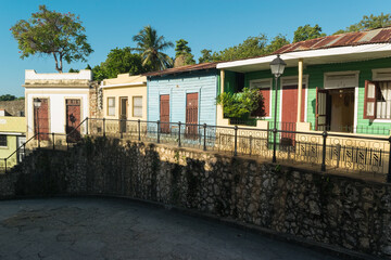 Colorful abandoned houses facades located in the streets of Santo Domingo, Dominican Republic.