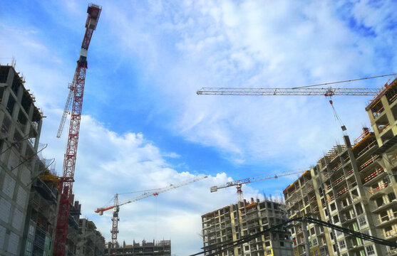 Construction crane on the construction site of a multi-storey building. Daytime. Stock image.