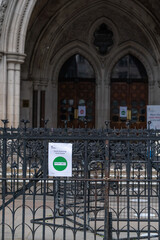 Sign outside Royal Courts of Justice in London, Strand, England advising of social distancing requirements following Coronavirus COVID-19 - 2