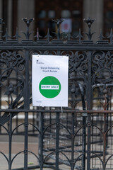 Sign outside Royal Courts of Justice in London, Strand, England advising of social distancing requirements following Coronavirus COVID-19 - 3