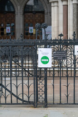 Sign outside Royal Courts of Justice in London, Strand, England advising of social distancing requirements following Coronavirus COVID-19 - 1