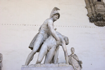 Florence, Italy August 16 2018: Aiace and Achille marble sculpture, located in Loggia de' Lanzi, in piazza della Signoria