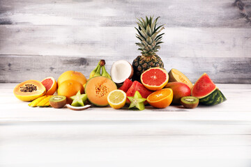 Tropical fruits background, many colorful ripe fresh tropical exotic fruits