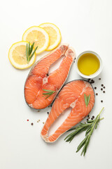 Composition with salmon meat and spices on white background, top view