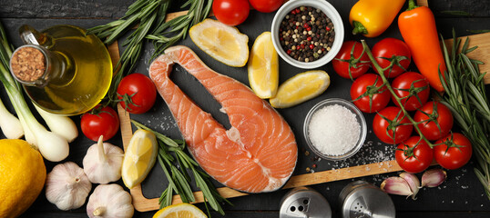 Composition with salmon meat and spices on wooden background, top view