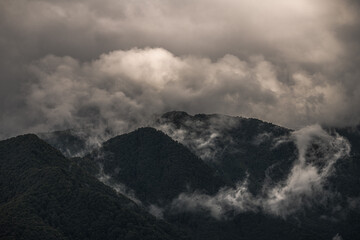 Fototapeta premium Mysterious black mountain with dramatic cloudy sky