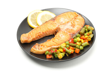 Plate with grilled salmon and vegetables isolated on white background