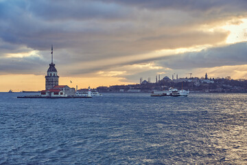 Fototapeta na wymiar Istanbul sunet panorama with landmarks, Maiden Tower / Kiz Kulesi, Hagia Sophia and Bosphorus. Istanbul, Turkey