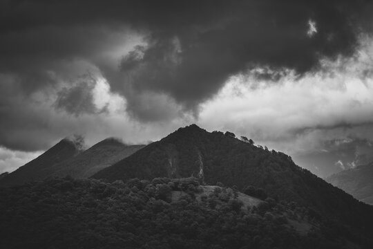 Mysterious black mountain with dramatic cloudy sky © Marc Andreu