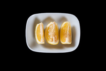 Lemon slices on a white plate. Food 
