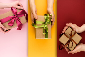 Set of three types of gifts on colorful backgrounds close-up with copy space