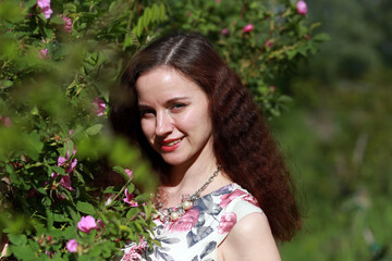 Portrait of brown haired woman outside 