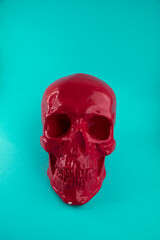 Red scary skull lies on a blue background