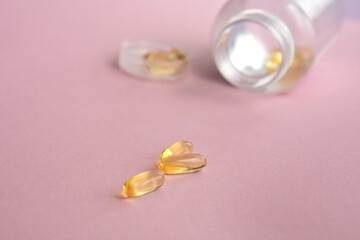 Fish oil capsules with omega 3 and vitamin D, healthy concept