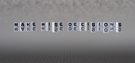 make wise decisions concept represented by black and white letter cubes on a grey horizon background stretching to infinity