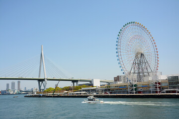 City scene  with sky wheels and  cross sea bridge Osaka