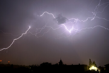 Lightning over the city at the night dramatic view high resolution
