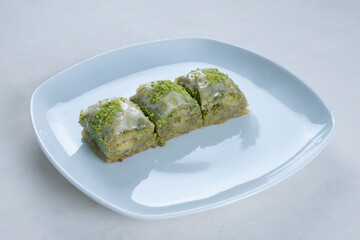 Pistachio baklava. Traditional dessert Baklava with pistachios. turkish dessert. Side view isolated white background