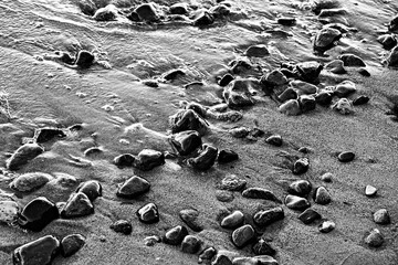 Stones  at sand baltic sea beach in Sopot, Poland
