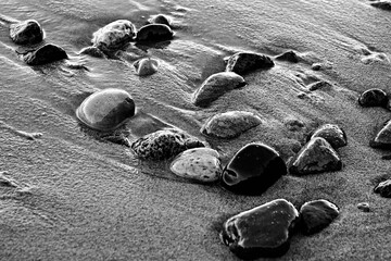 Stones  at sand baltic sea beach in Sopot, Poland

