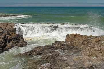Waves Pouring Over Coastal Rocks