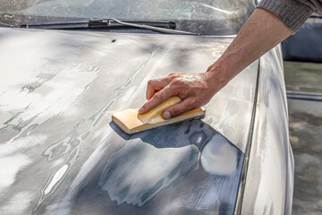 Car body work after the accident by cleaning before painting.
