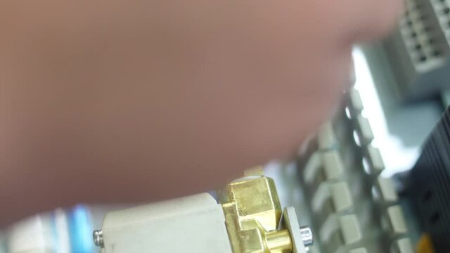 tighten brass nut with wrench in pneumatic automation system