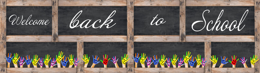 BACK TO SCHOOL banner background panorama -Many brightly painted children's hands with smileys,...