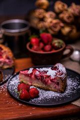 Organic homemade strawberry and rhubarb cake. Sweet food. Sweet dessert. Close up, selective focus.
