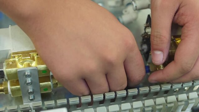 tighten brass nut with wrench in pneumatic automation system