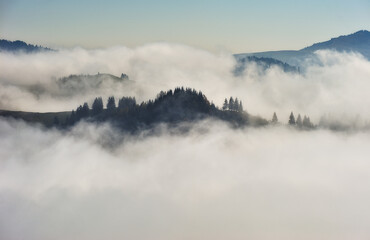 Predawn time in the highlands. mountain silhouettes in the fog
