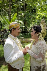 Indonesian bridal couples were dressed in traditional java  wedding costume