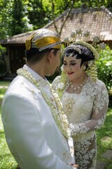 Indonesian bridal couples were dressed in traditional java  wedding costume
