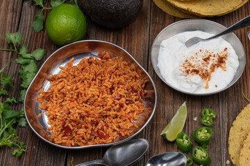 Mexican red chili rice and sour cream