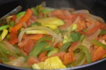 a lot of vegetables being cooked