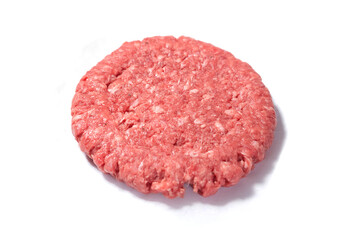 Fresh raw beef burger on a white surface.