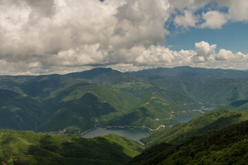 Remote locations for visiting are the best to relax in the nature. View from the top of the mountains with sky covered by a clouds in a sunny day. 