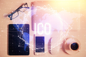 Double exposure of blockchain theme hologram over table with phone. Top view. Crypto technology...