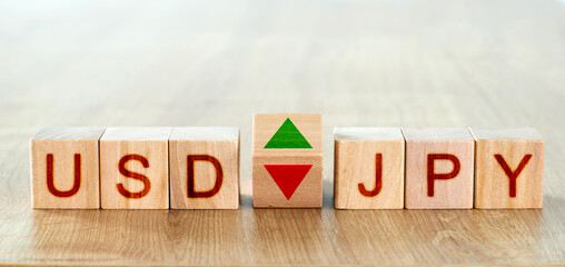 usd jpy concept. wooden blocks with the names of trading instruments in the foreign exchange market