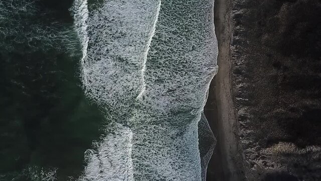 Stunning slow motion aerial footage of waves breaking off the coast of New Zealand. 
