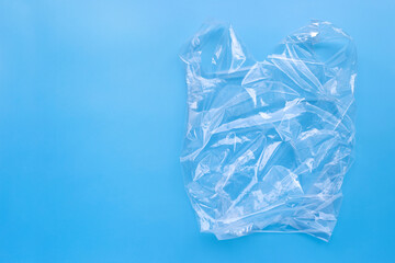 Obraz premium Plastic bag on blue background.